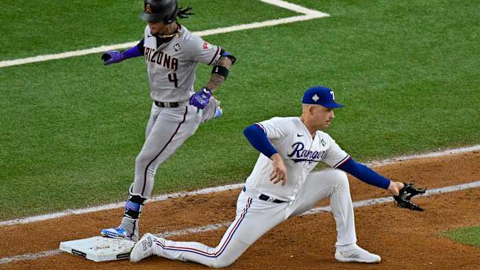 Texas Rangers first baseman Nathaniel Lowe puts out Arizona Diamondbacks second baseman Ketel Marte